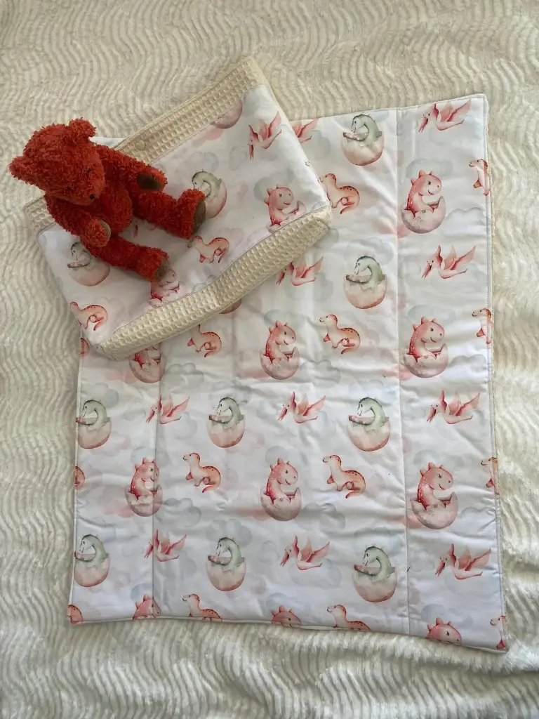 Tapis à langer nomade avec pochette dinosaures